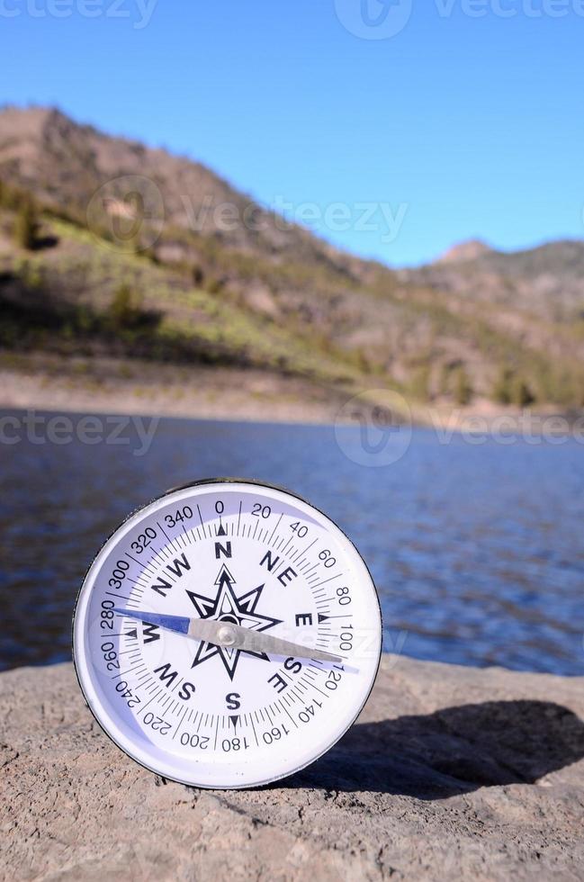 Compass on the rock photo