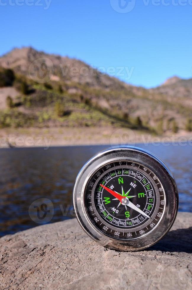 Compass on the rock photo