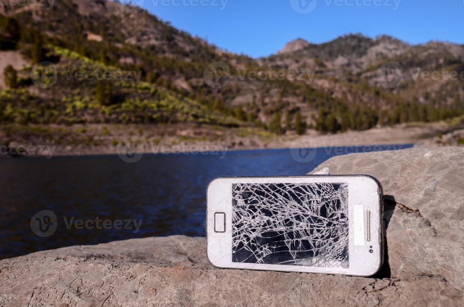 Smartphone on the rock photo