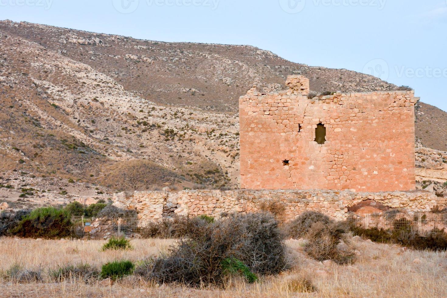 Abandoned structures in the desert photo