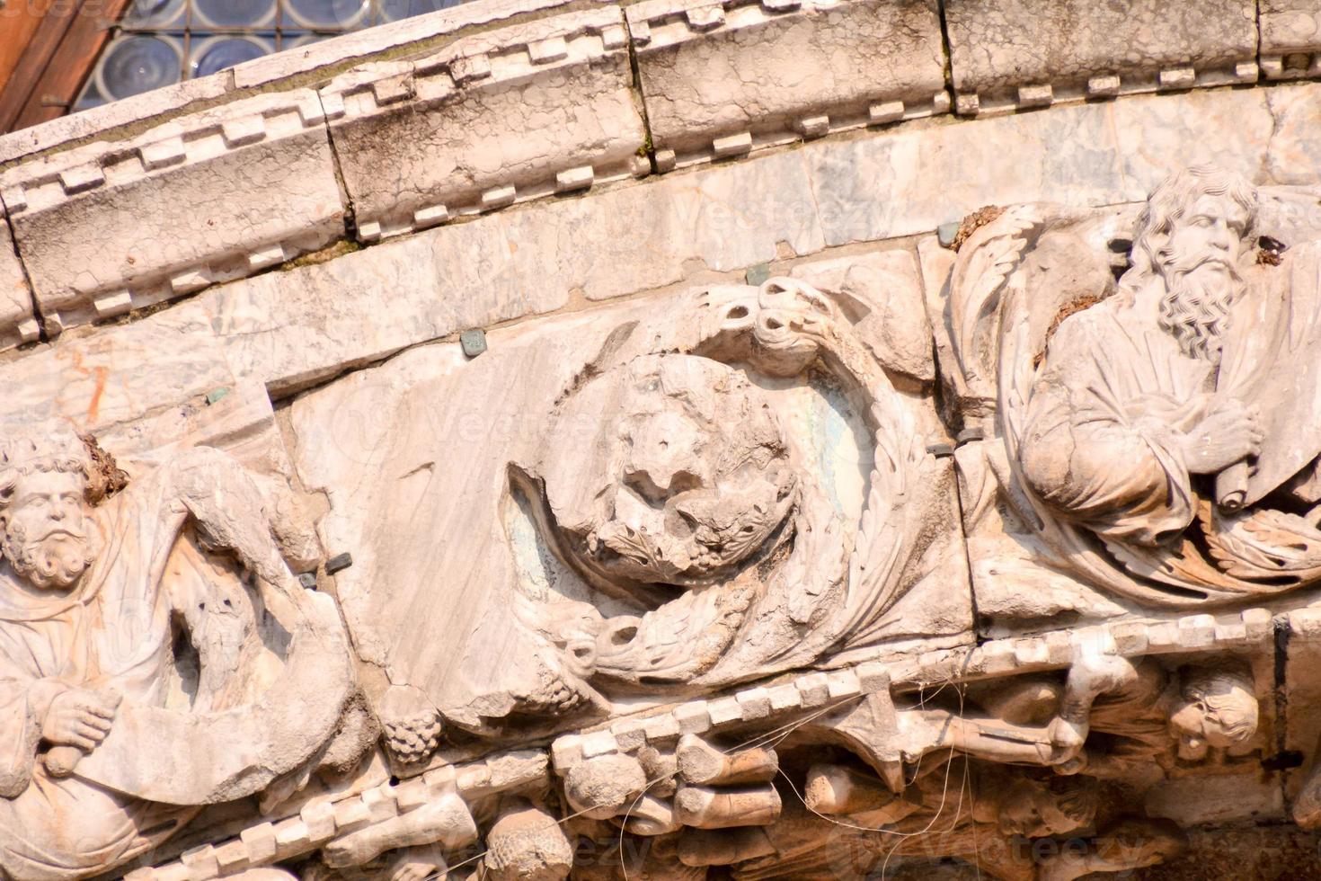 Ornate stone wall relief photo