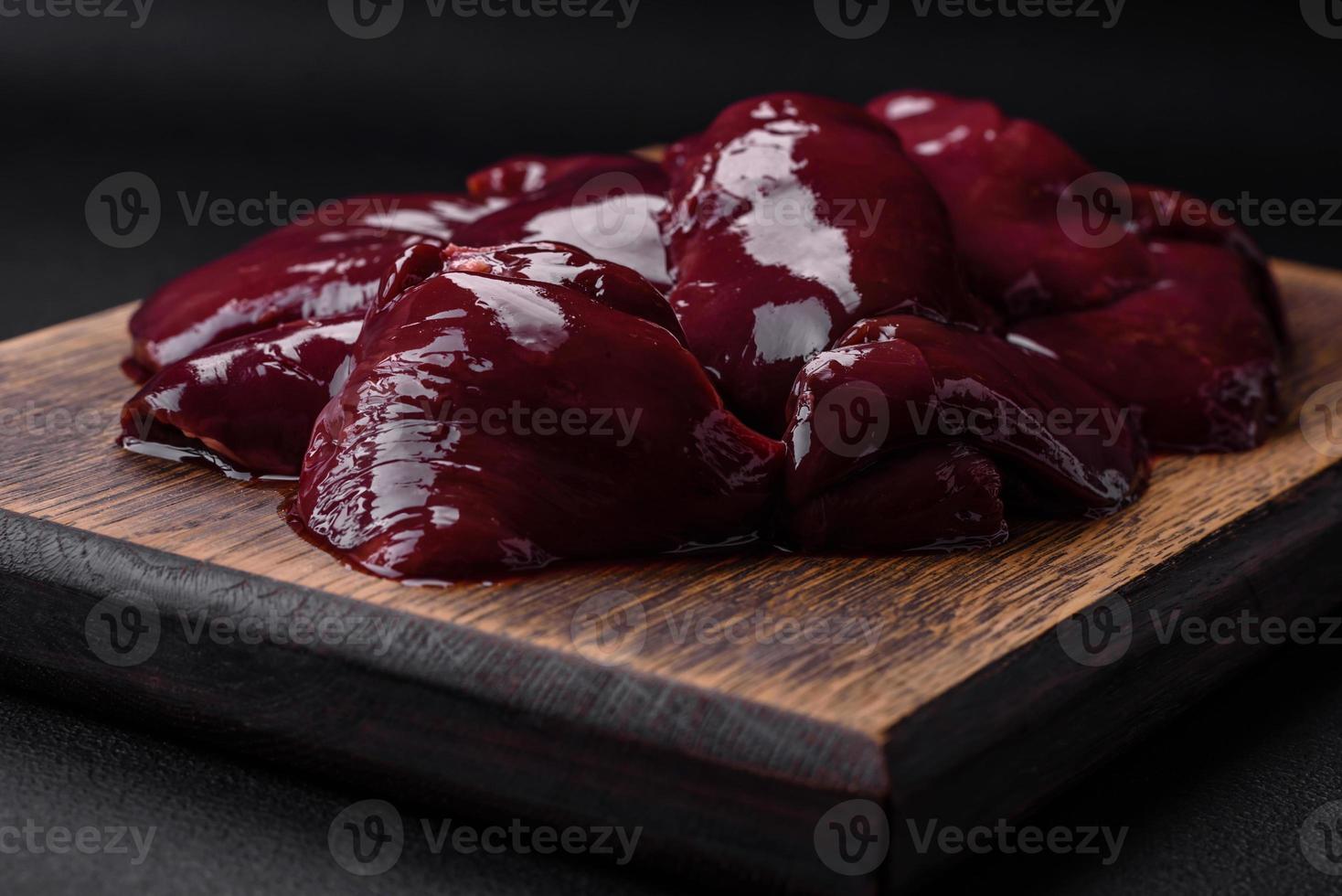 Fresh raw chicken, turkey or duck liver with salt, spices and herbs photo