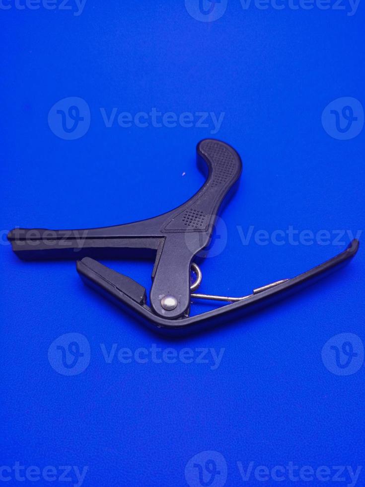 guitar capo isolated picture closeup photo