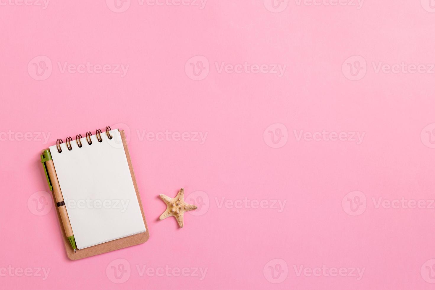 Summer holidays concept. travel background with notepad and starfish . Top view. Flat lay photo