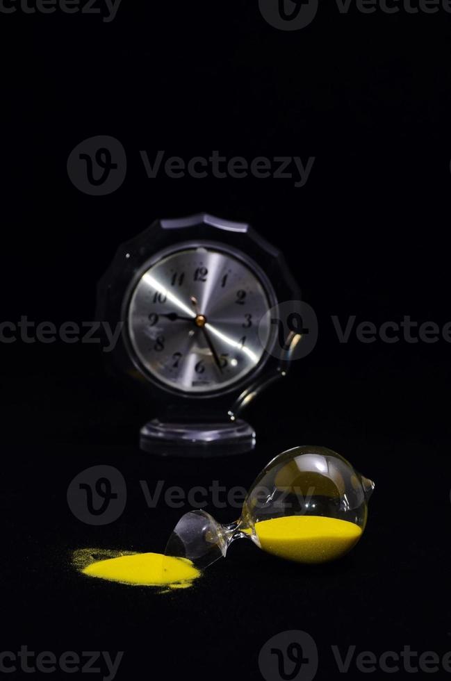 Hourglass on dark background photo