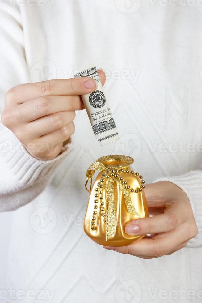 Close-up Of A Woman Holding Gift Box Of Dollar photo