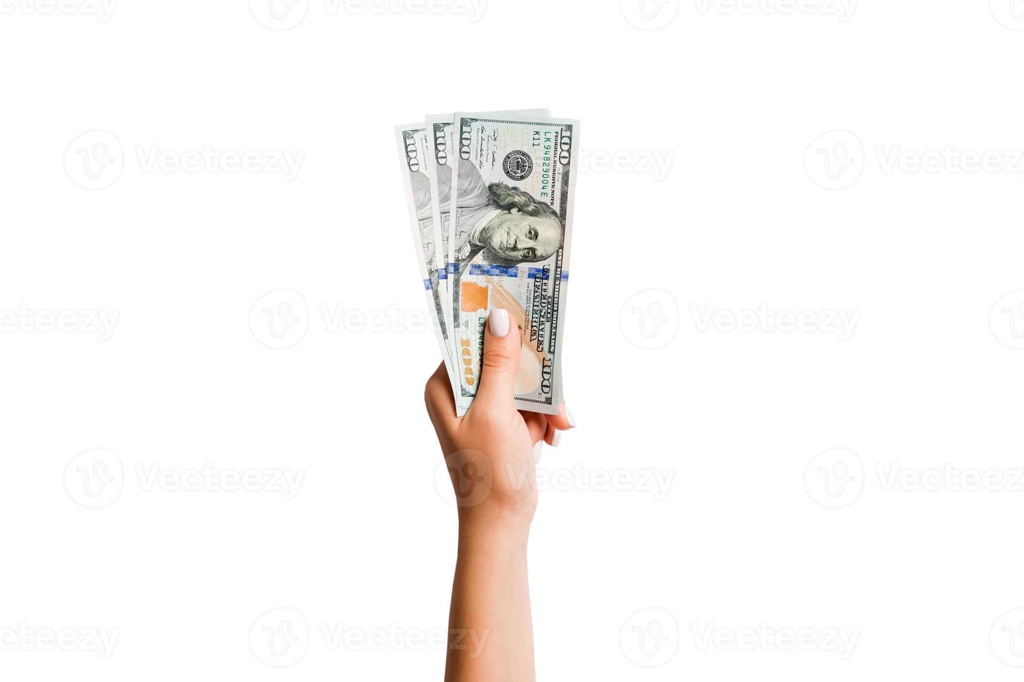 Top view of dollar banknotes in female hand on white isolated background. Business concept photo