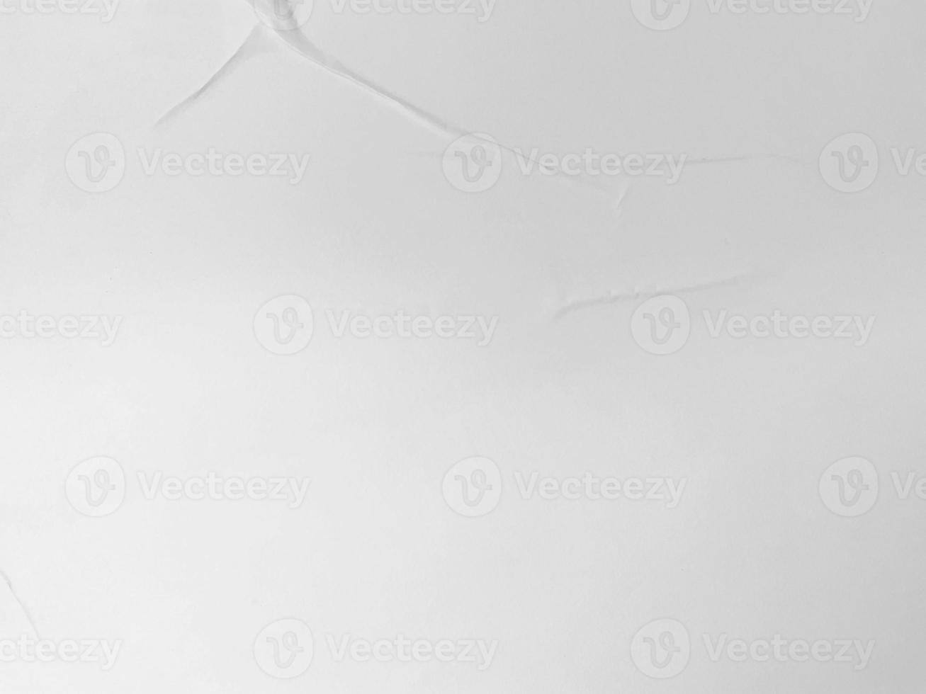 blank white glued paper for poster texture overlay. Crumpled and wrinkled for background. matted wet paper for mockup posters, flyer, brochure, and banner design photo