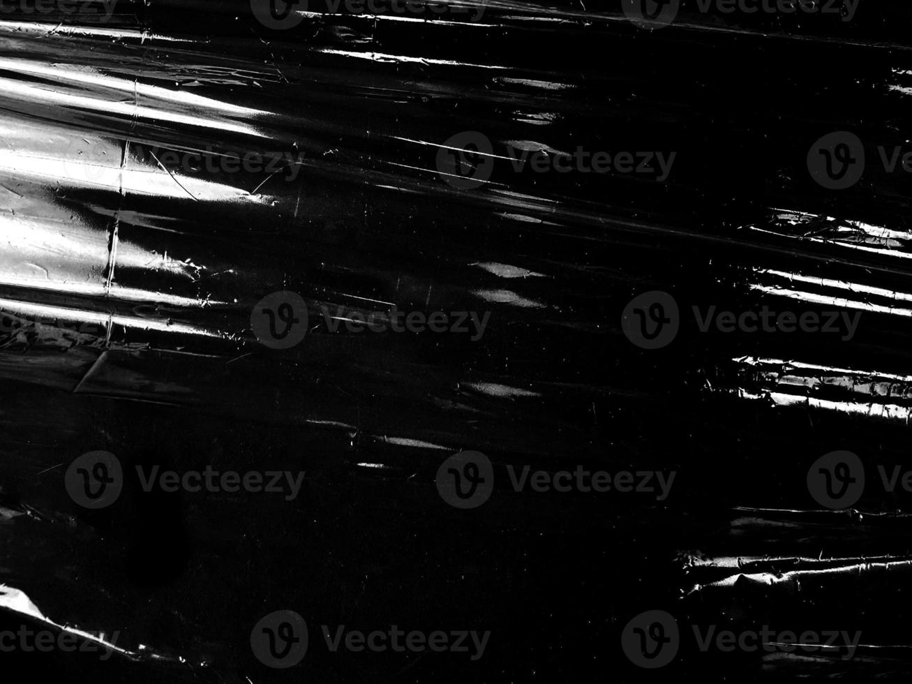 Black transparent plastic wrap texture overlay background. Realistic plastic for poster design and photo overlay effect. Wrinkled plastic surface