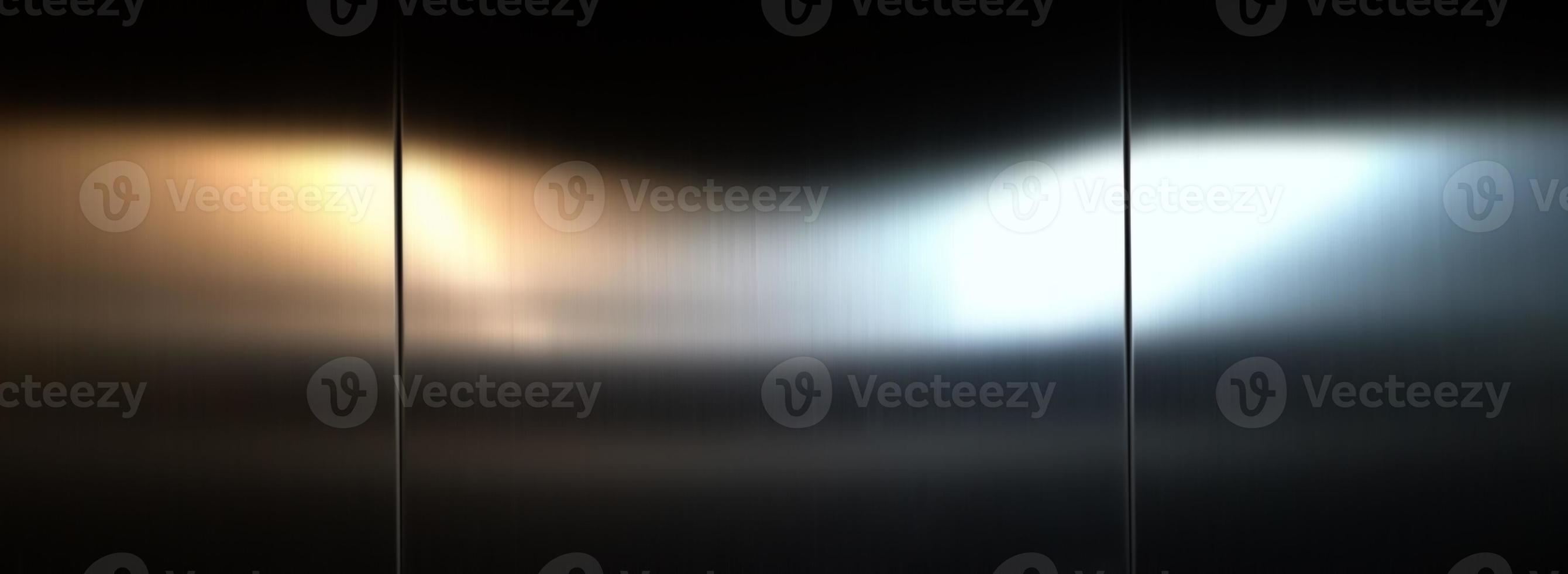 Stainless steel large sheet  With light hitting the surface,Inside passenger elevator,Reflection of light on a shiny metal texture,stainless steel background,metal texture background. photo