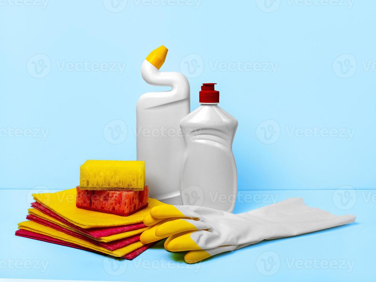 A set of cleaning products for cleaning the house and washing windows. Rubber gloves, sponges, napkins and liquid soap photo