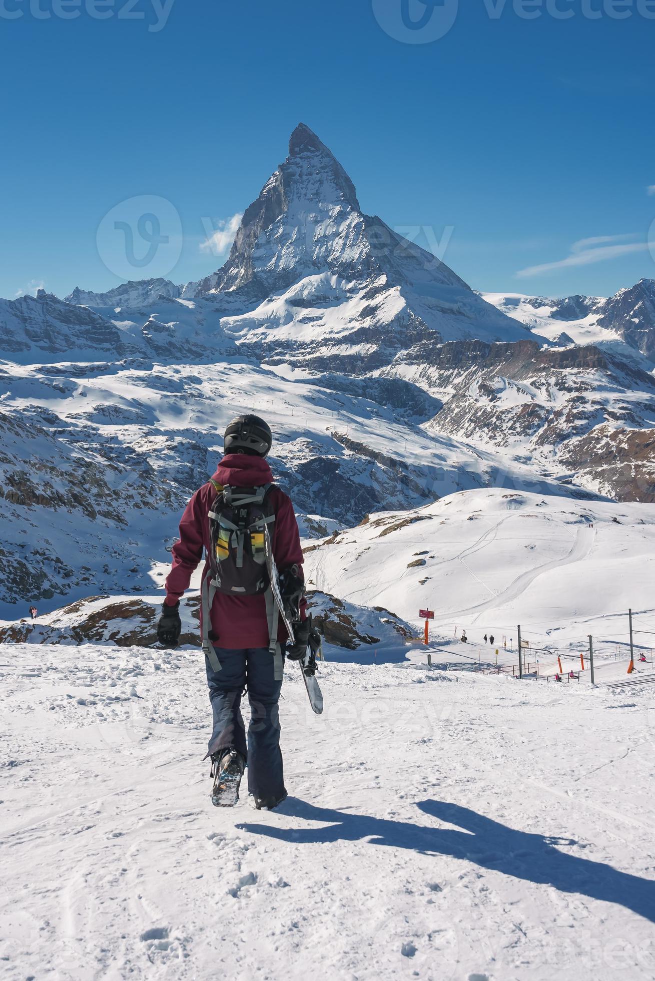 Young snowboarder spending winter holidays in Zermatt, near the famous
