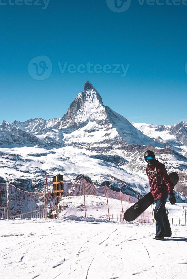 Young snowboarder spending winter holidays in Zermatt, near the famous