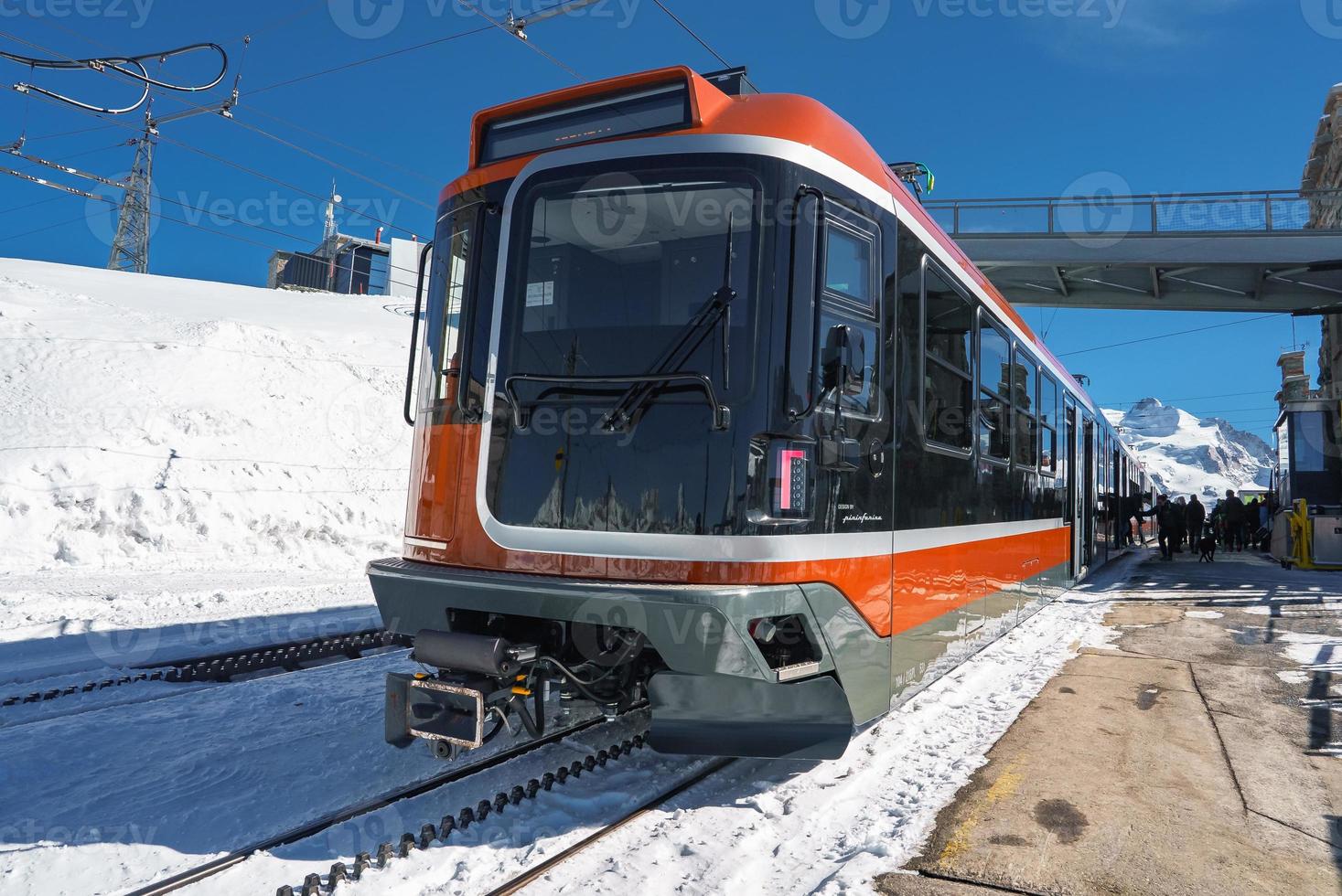 The train of Gonergratbahn running to the Gornergrat station and Stellarium Observatory - famous touristic place with clear view to Matterhorn. Glacier Express train. photo