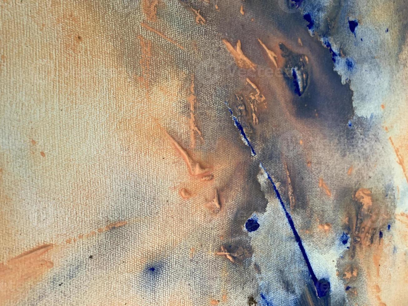 A blue and orange painting with a white background and blue paint. photo