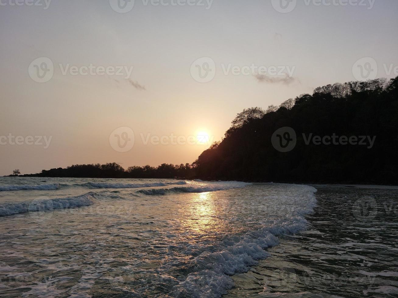 Sunset on the beach on the evening island in Thailand photo