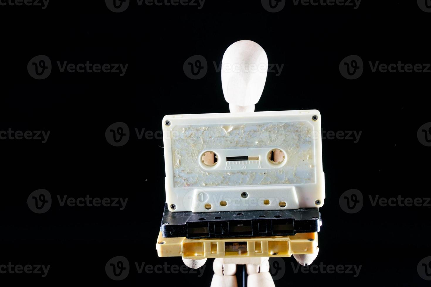 Wooden mannequin figurine on dark background photo