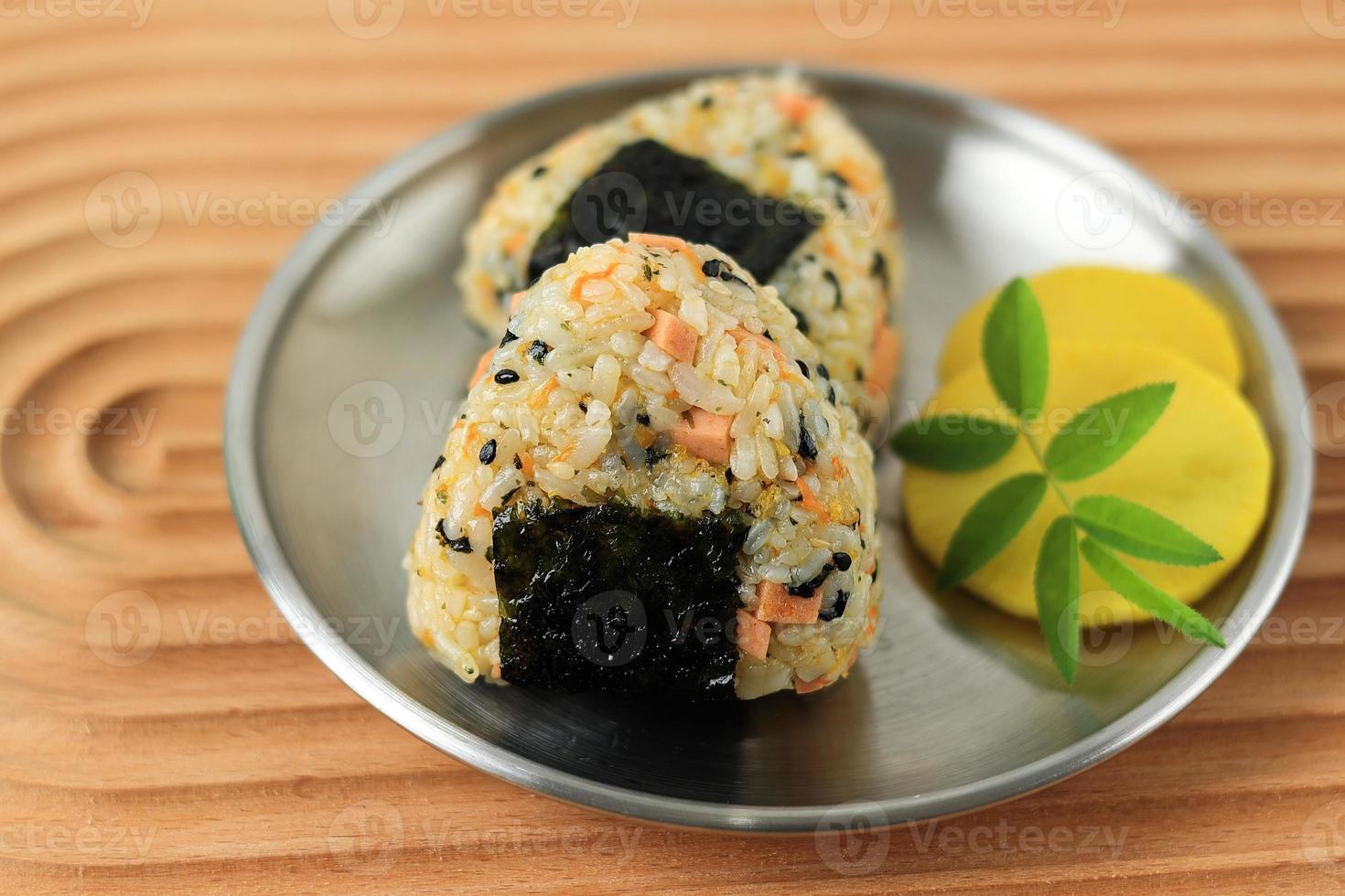 Triangle Onigiri with Sesame Seed, Sausage, Nori, and Ham photo