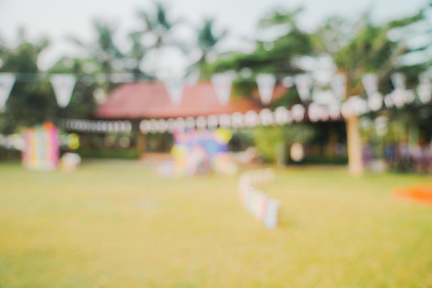 Defocused bokeh and blur background of garden trees in sunlight with vintage toned. photo