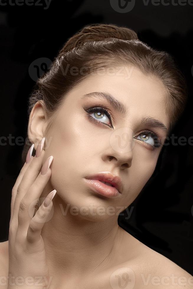 Model girl with natural natural make-up and beautiful manicure. Matt lipstick. Nude shades of makeup. photo