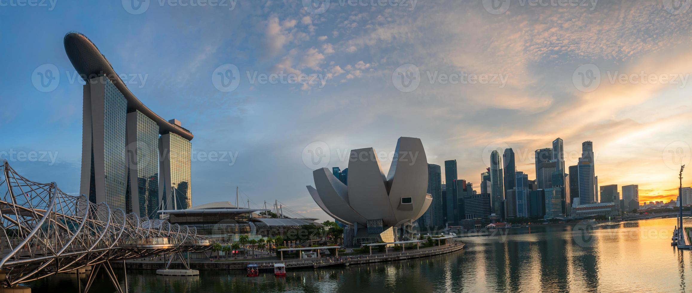 Landscape view of Singapore business district and city at twilight. Singapore cityscape at dusk building around Marina bay. photo