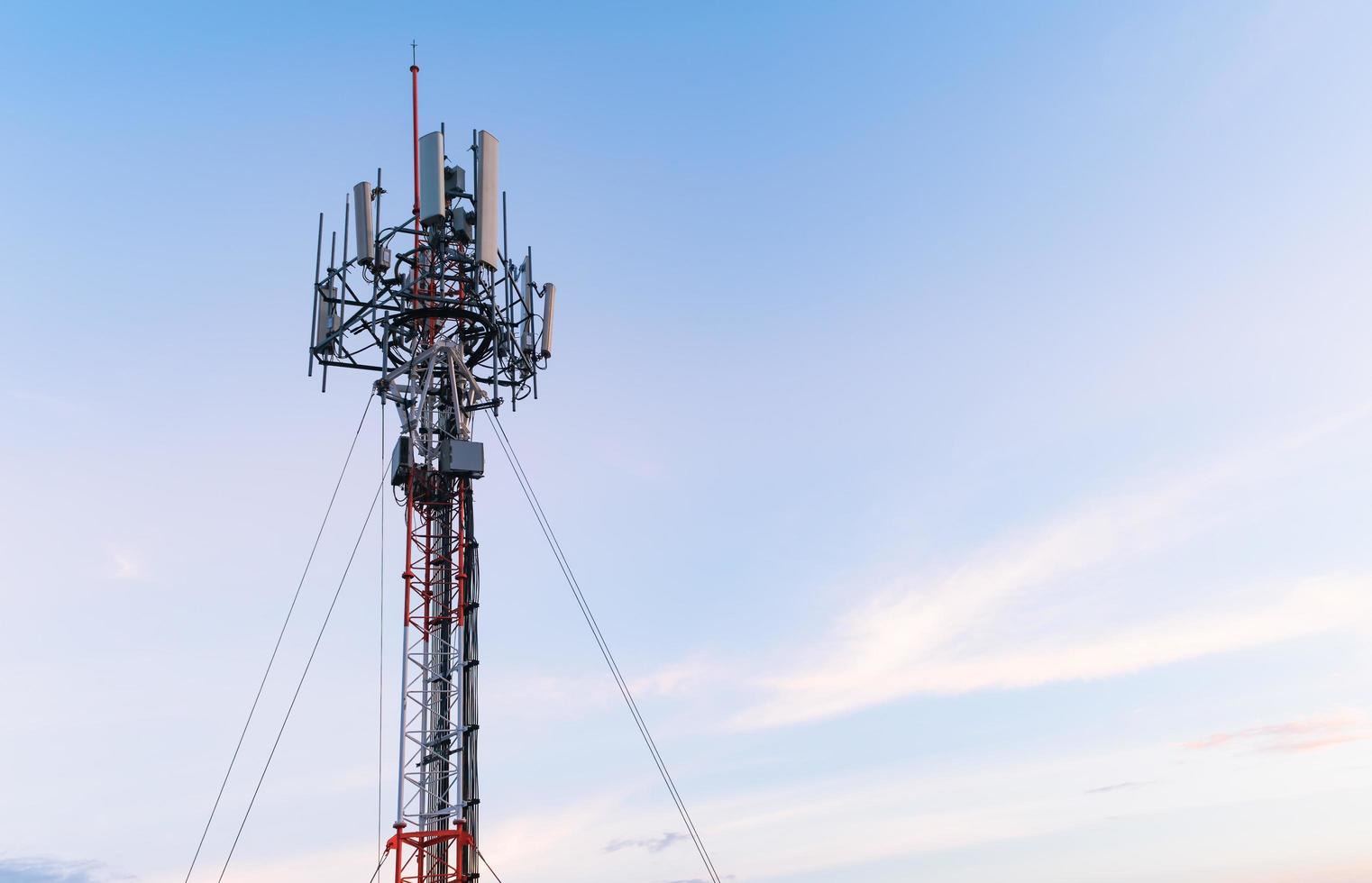 tower mobile phone on evening sky photo