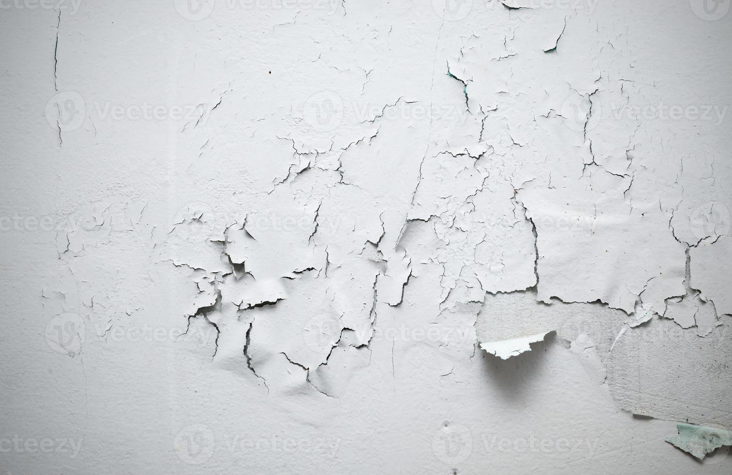 cracked paint on wall in room photo