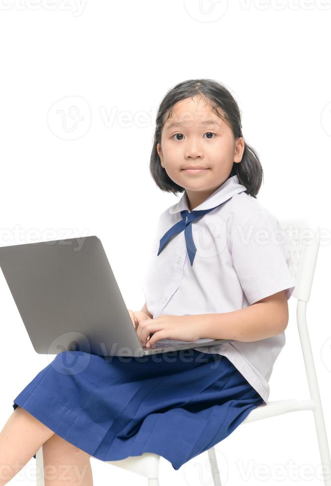 cute asian student playing computer laptop and computer concept photo