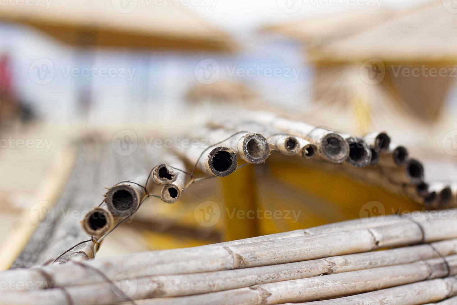 Close-up of bamboo umbrellas on the beach. selective focus. photo
