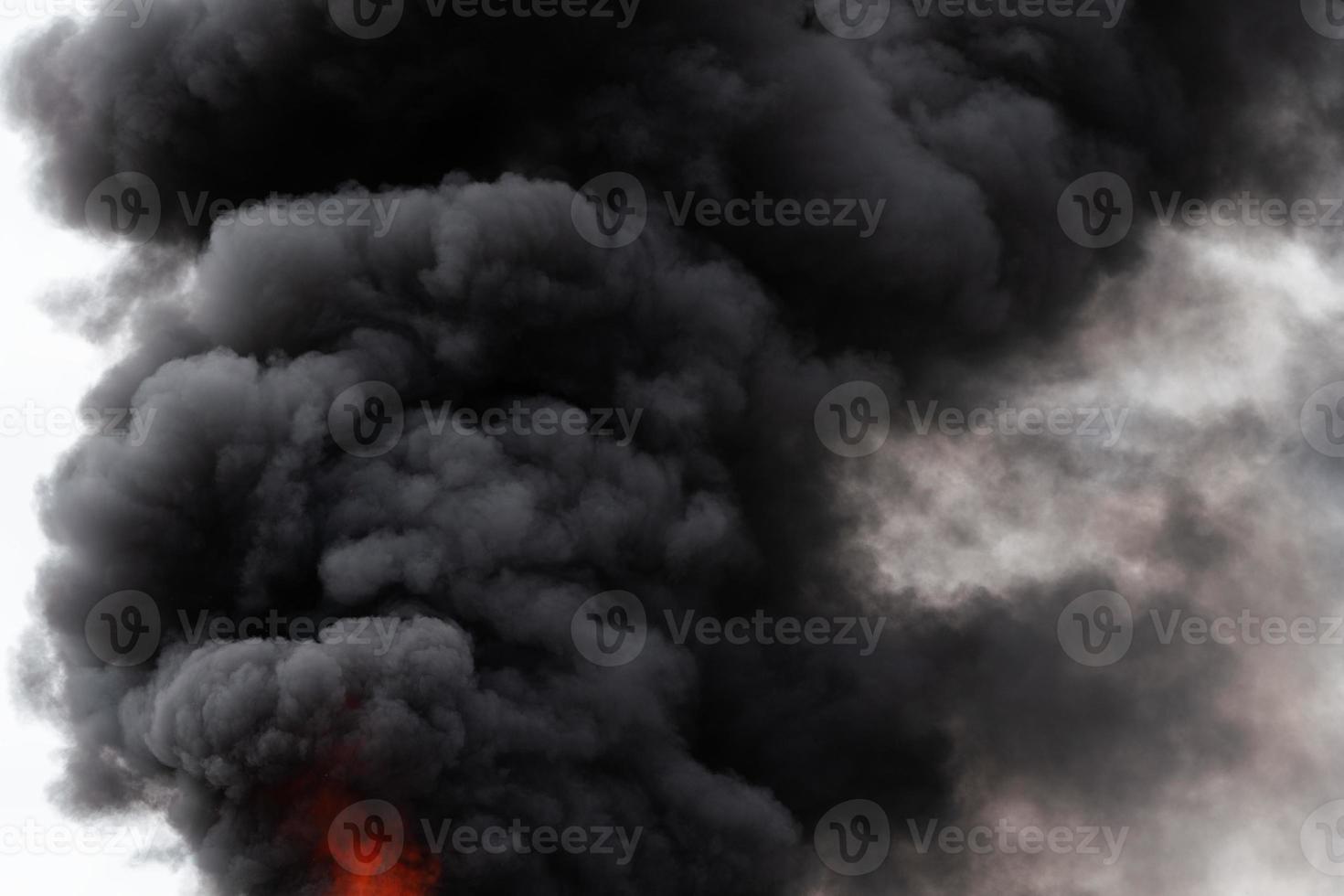 Black motion clouds of strong fire smoke covered sky photo