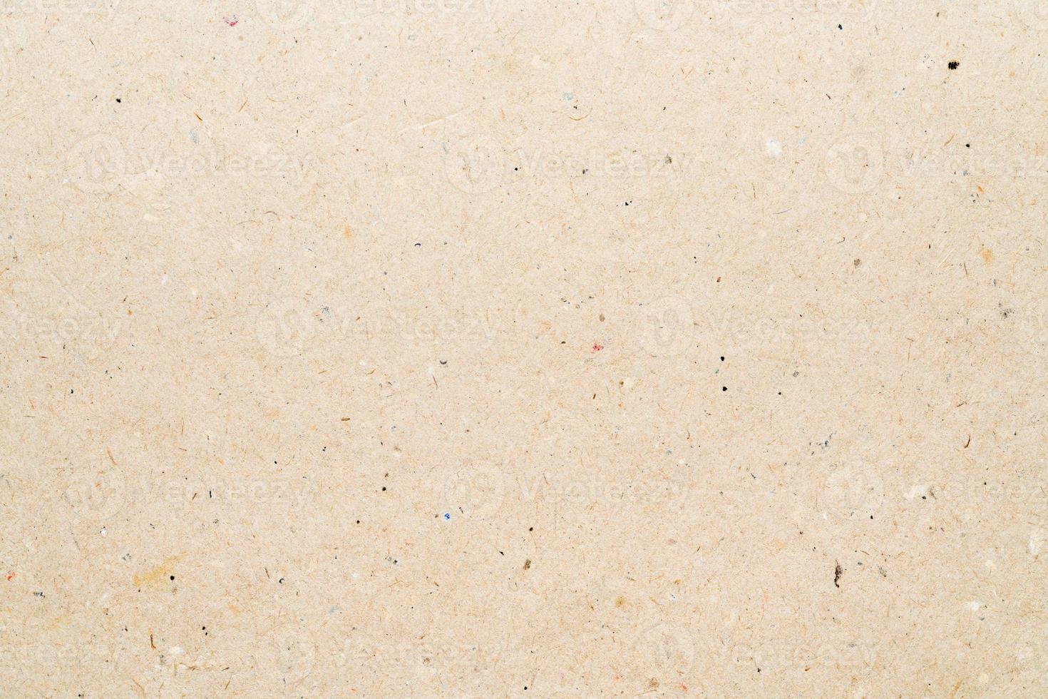 Yellow texture sheet of recycled cardboard. Close-up abstract carton background photo