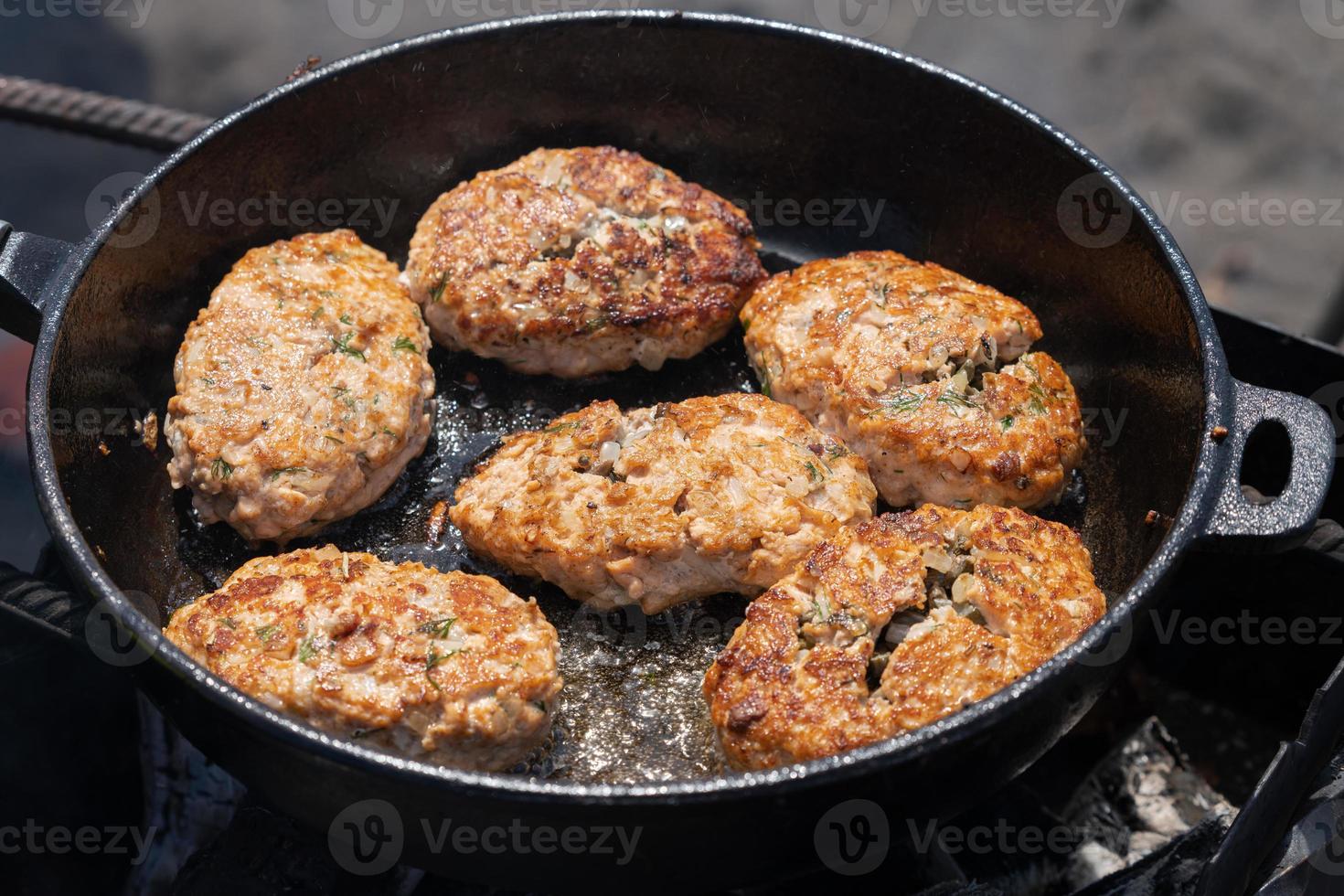 Delicious wild red salmon fish crispy cutlets fried in griddle roast on coals photo