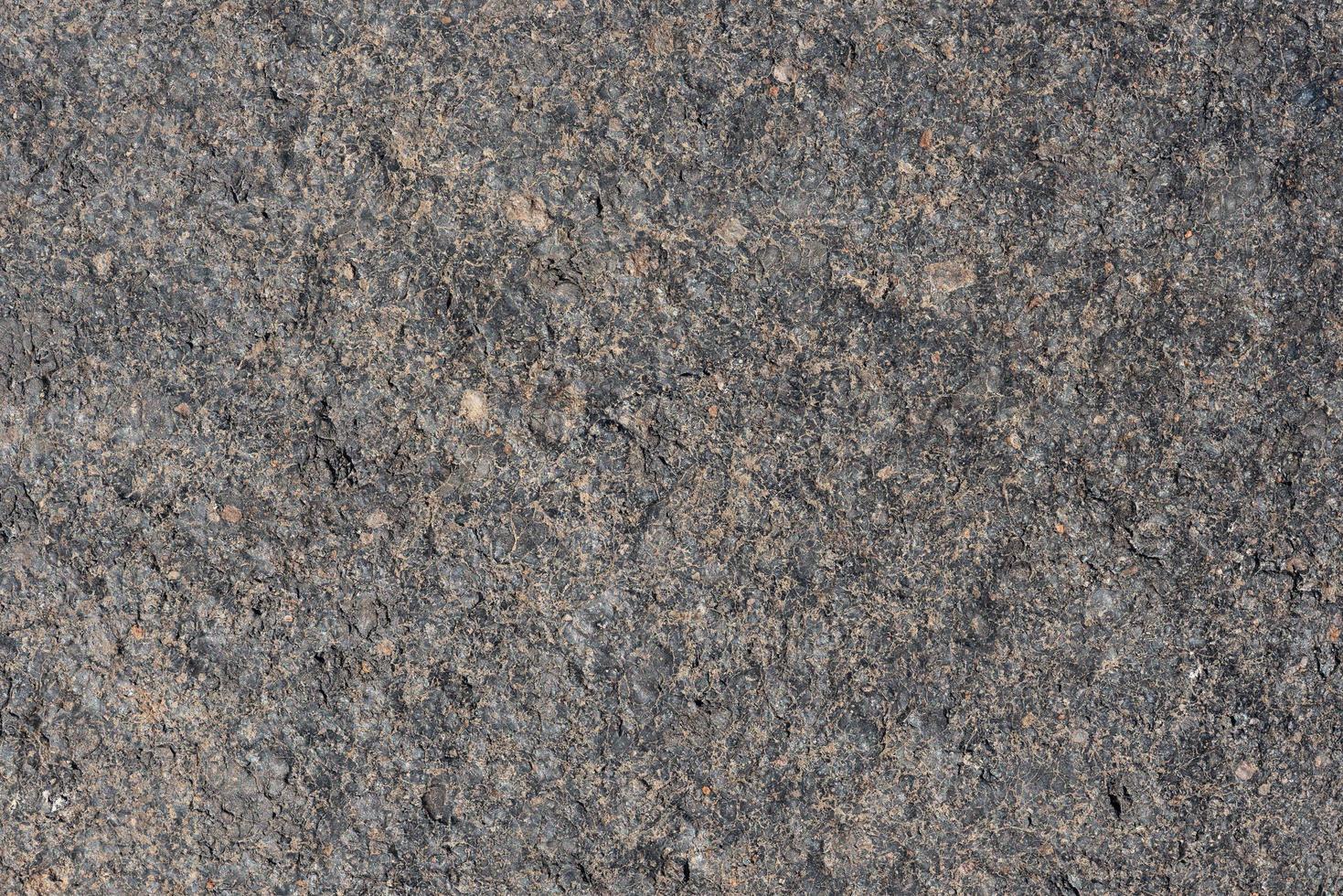 Gray volcanic sand, small stone surface. Detailed natural background or