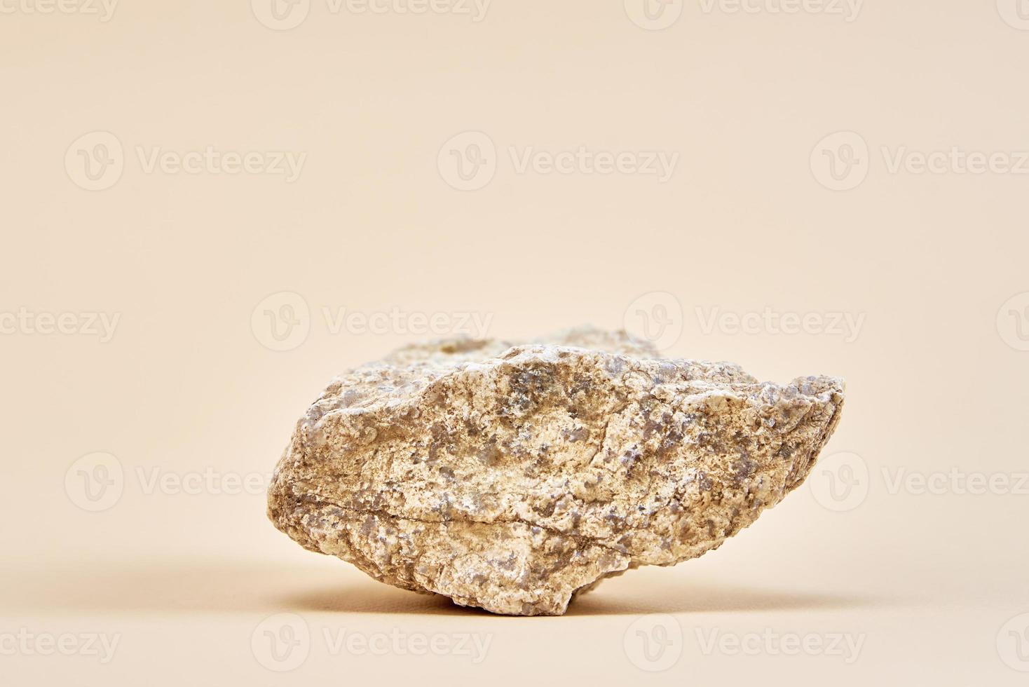 Natural granit stone on beige background photo