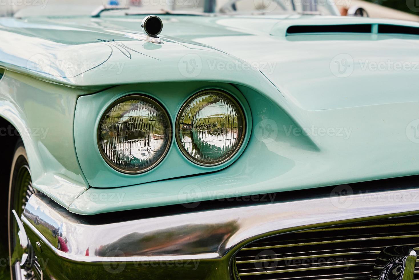 Closeup headlight of retro car photo