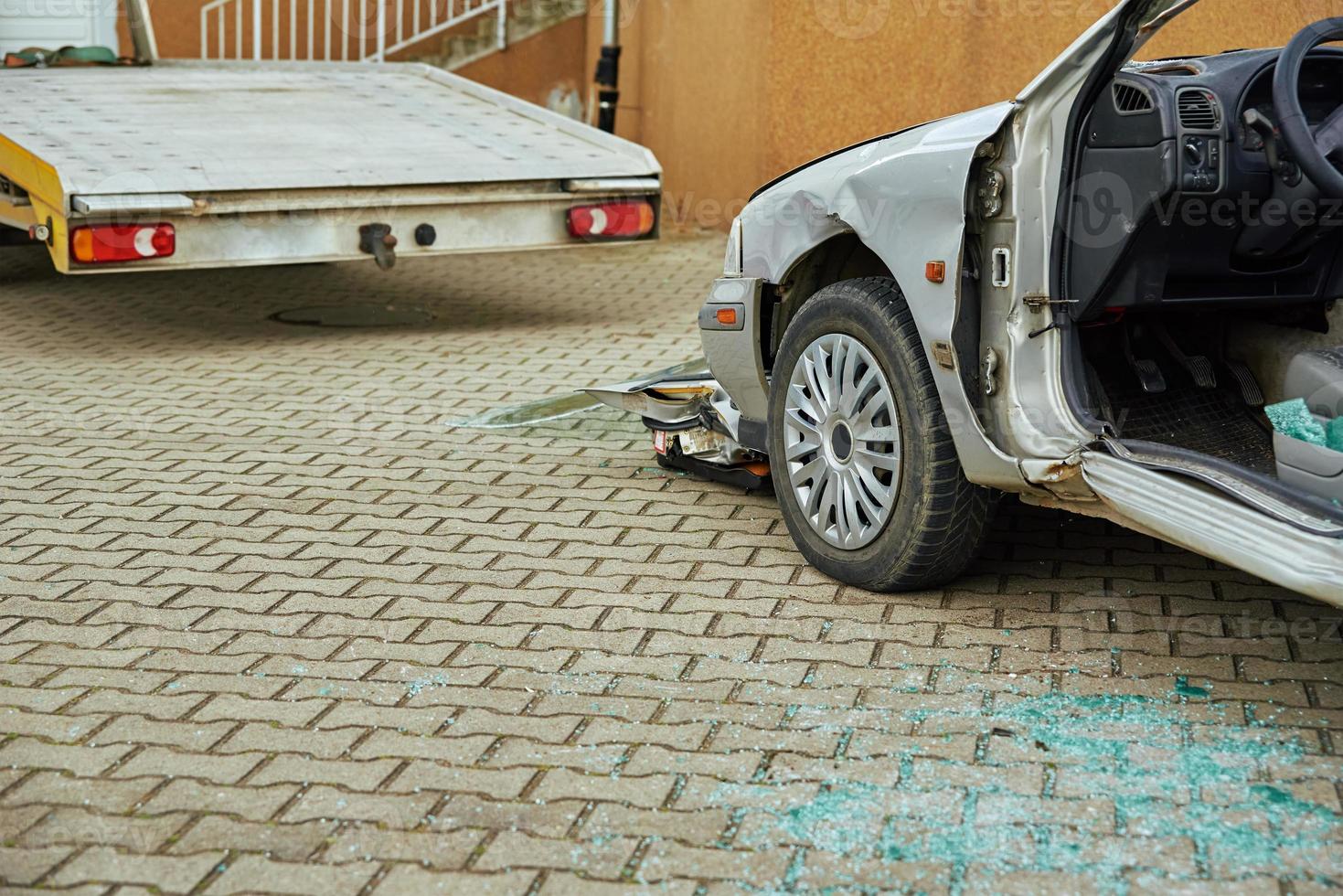 Crashed car after traffic accident on road photo