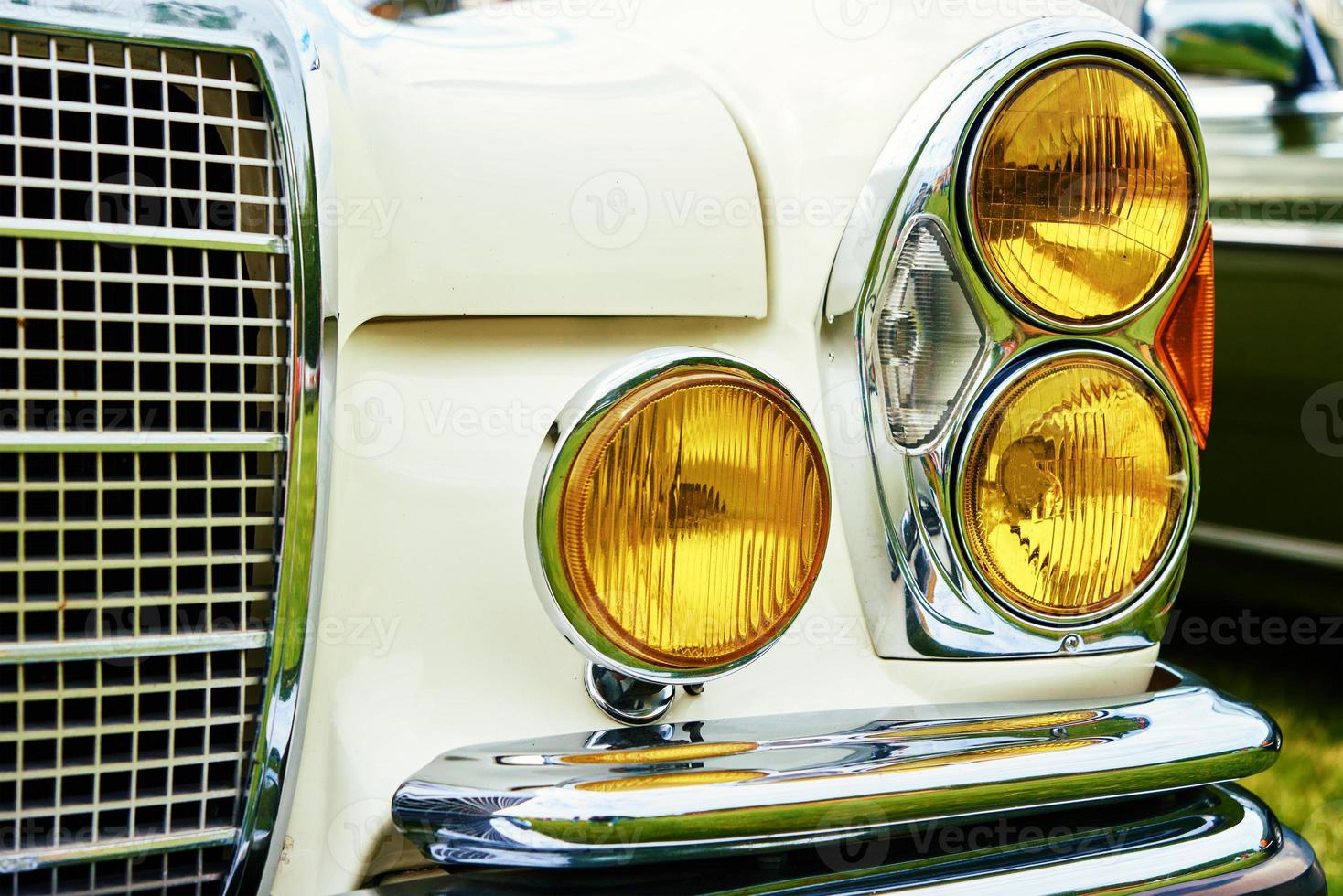 Closeup headlight of retro car photo