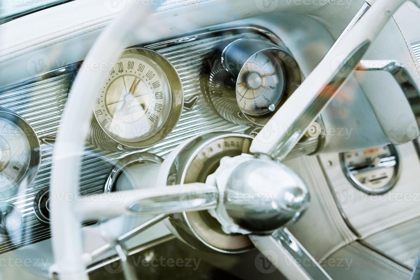 Retro car dashboard with srteering wheel photo