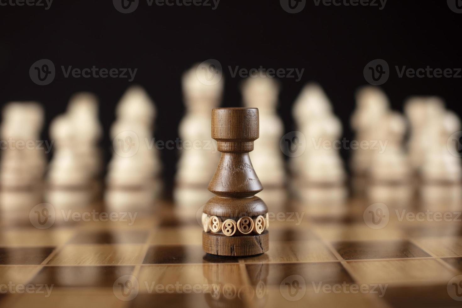 Chess on a dark background. A puzzle game with tricky combinations that requires planning and thinking. photo