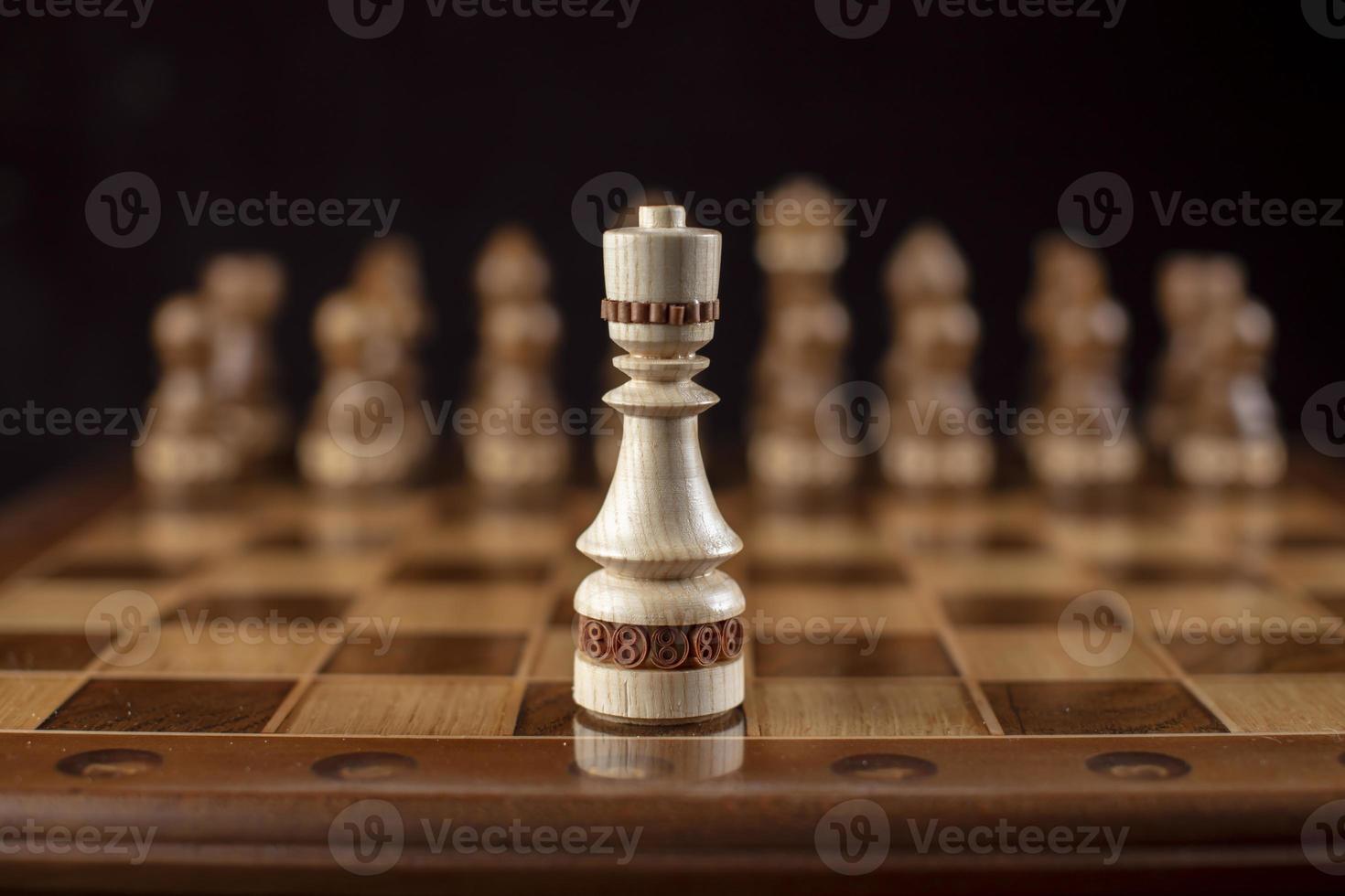 Chess on a dark background. A puzzle game with tricky combinations that requires planning and thinking. photo