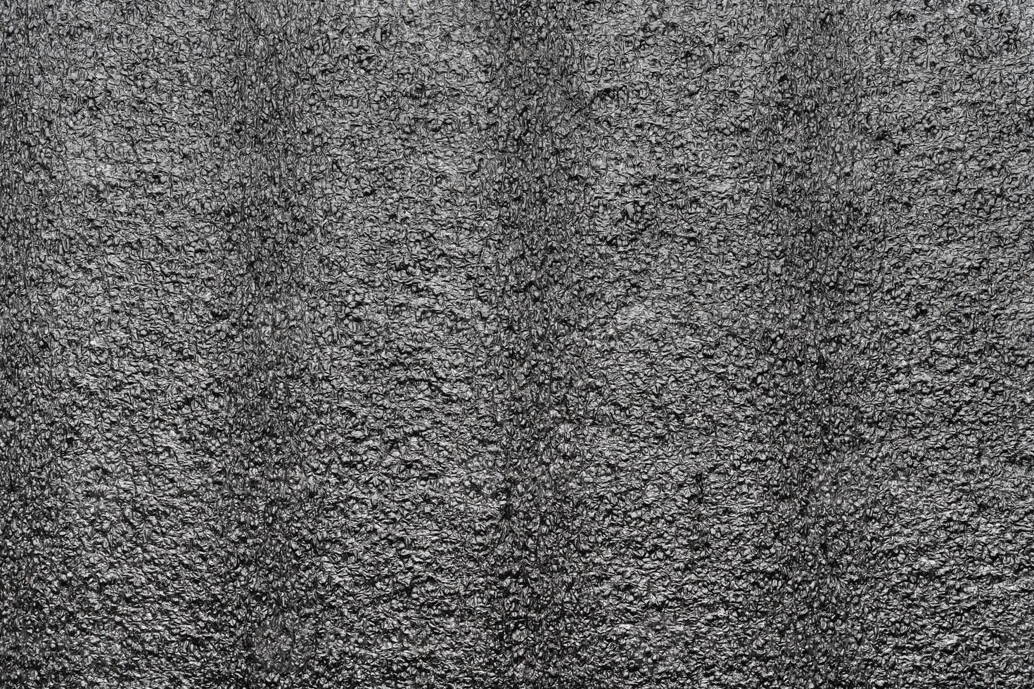 Black abstract polystyrene foam texture background. Close-up styrofoam material photo
