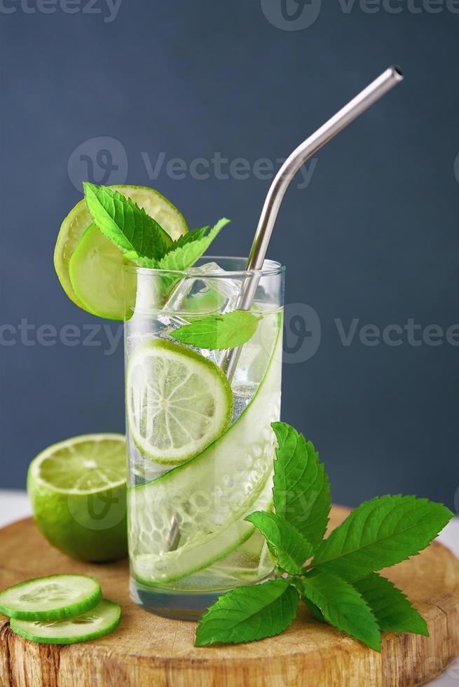 Detox refreshment drink. Lemonade with lime and cucumber photo
