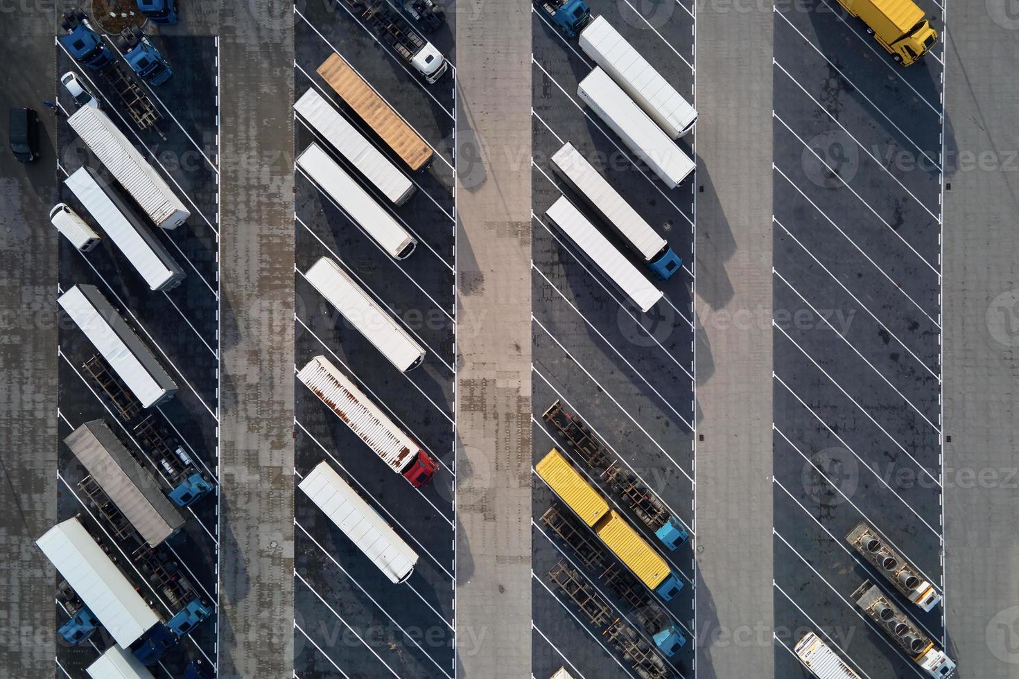 Top view of trucks on parking lot near logistic warehouse photo