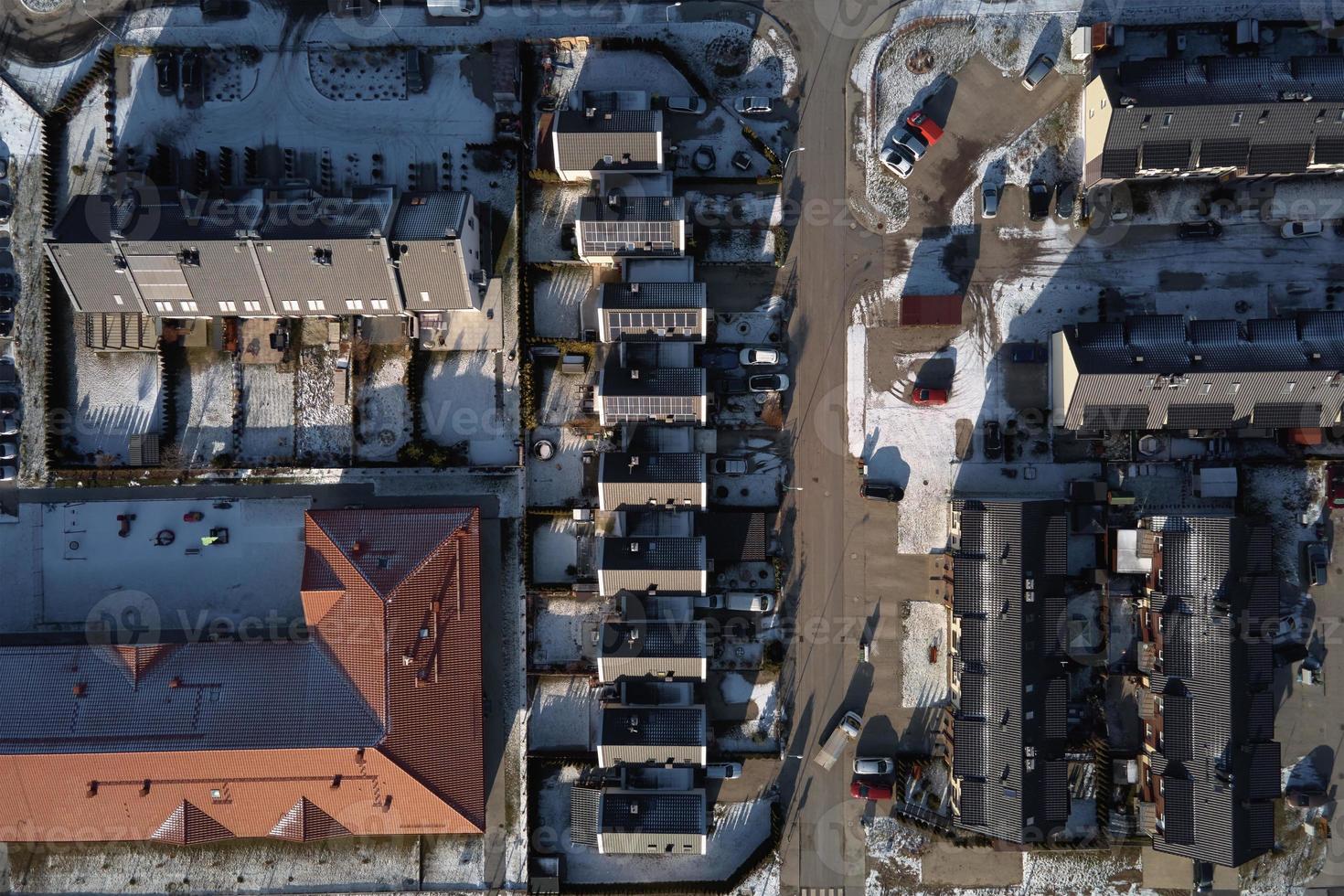 Aerial drone view of residential neighborhood in winter season photo