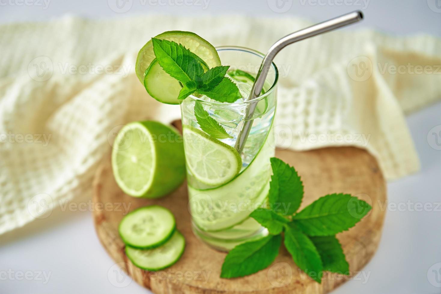 Detox refreshment drink. Lemonade with lime and cucumber photo