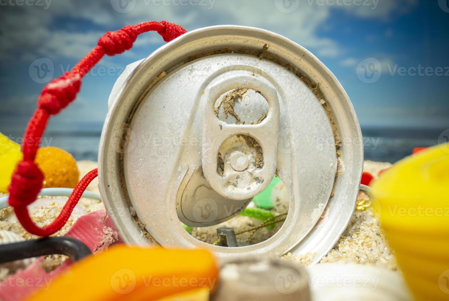 A beautiful beach covered with rubbish and trash photo