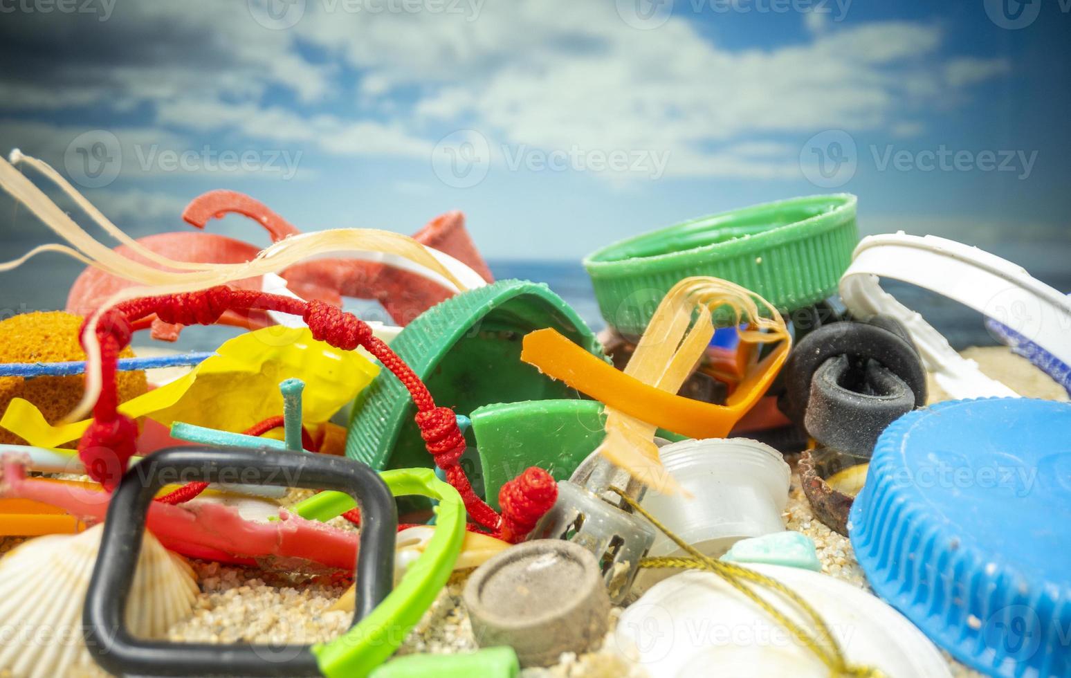 A beautiful beach covered with rubbish and trash photo