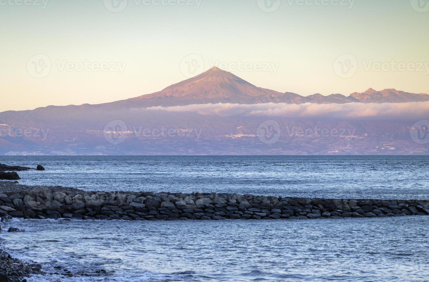 El teide volcano viewed from beach in tenerife spain photo
