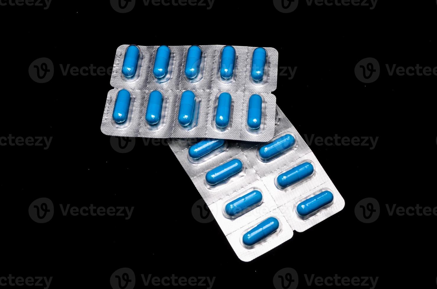 Pills on dark background photo