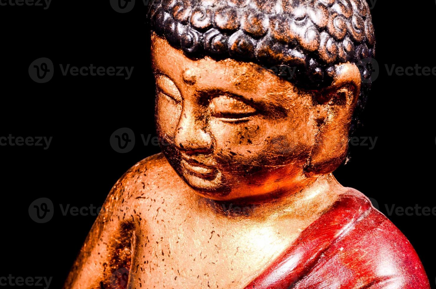 Buddha statue on dark background photo